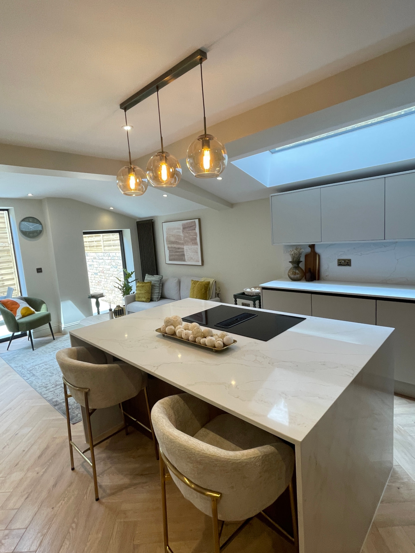 Sparkling open-plan kitchen with marble island after a deep clean